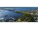 An aerial view of the river with a bridge, houses, and buildings surrounding it at 3606 S Peninsula Dr # 406, Port Orange, FL 32127