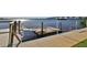 Community boat dock with waterfront views of the surrounding community under a sunny sky at 3606 S Peninsula Dr # 406, Port Orange, FL 32127