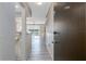 Hallway view of condo #406 featuring light gray floors and partial views of the Living Room at 3606 S Peninsula Dr # 406, Port Orange, FL 32127
