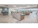 Community lounge with comfortable seating and picturesque water views through large windows at 3606 S Peninsula Dr # 406, Port Orange, FL 32127