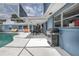 The screened-in pool has a grill and outdoor seating with lots of space to entertain at 38 Fairway Cir, New Smyrna Beach, FL 32168