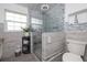 Contemporary bathroom featuring a glass shower, modern fixtures, and neutral tiling for a clean, updated look at 38 Fairway Cir, New Smyrna Beach, FL 32168