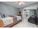A bedroom featuring a twin bed, massage chair, and sliding glass doors at 38 Fairway Cir, New Smyrna Beach, FL 32168