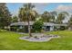 Charming single-story home with a well-manicured lawn and tropical landscaping in a serene setting at 38 Fairway Cir, New Smyrna Beach, FL 32168