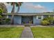 Comfortable front porch sitting area, providing a welcoming entrance to the home at 38 Fairway Cir, New Smyrna Beach, FL 32168