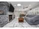 Spacious living area with sleek flooring, a contemporary fireplace, and an open layout at 38 Fairway Cir, New Smyrna Beach, FL 32168