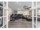 Spacious living room features French doors, ample natural light, and comfortable seating, perfect for relaxing and entertaining at 38 Fairway Cir, New Smyrna Beach, FL 32168
