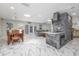 Bright and open-concept living space with skylights, tile flooring, and modern accents at 38 Fairway Cir, New Smyrna Beach, FL 32168