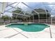 Beautiful screened-in pool with clear blue water and a spa at 38 Fairway Cir, New Smyrna Beach, FL 32168