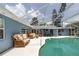 Inviting screened-in pool area with ample seating and outdoor dining, perfect for relaxing or entertaining at 38 Fairway Cir, New Smyrna Beach, FL 32168