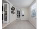 Bright sun room with tile flooring, and a hat collection on the wall at 38 Fairway Cir, New Smyrna Beach, FL 32168