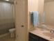 Bathroom features a vanity with sink, toilet, and shower/tub at 3824 Saxon Dr, New Smyrna Beach, FL 32169