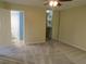Cozy bedroom with neutral carpeting, mirrored closet doors, and ensuite bathroom at 3824 Saxon Dr, New Smyrna Beach, FL 32169