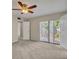 This spacious bedroom has a ceiling fan and sliding glass doors to let in natural light at 3824 Saxon Dr, New Smyrna Beach, FL 32169