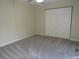 Bedroom features carpeting and a closet for ample storage at 3824 Saxon Dr, New Smyrna Beach, FL 32169