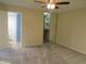 Bright bedroom featuring neutral walls, carpeting, a ceiling fan and closet for ample storage at 3824 Saxon Dr, New Smyrna Beach, FL 32169
