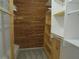 Walk-in closet with custom wood shelves and storage for organization and style at 3824 Saxon Dr, New Smyrna Beach, FL 32169