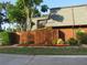 Charming home featuring a well-maintained yard, privacy fence, and lush greenery, creating a cozy and inviting atmosphere at 3824 Saxon Dr, New Smyrna Beach, FL 32169