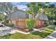 Charming two-story townhouse featuring a private wooden fence, mature trees, and well-maintained landscaping at 3824 Saxon Dr, New Smyrna Beach, FL 32169