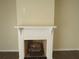 Close-up shot of the decorative fireplace, providing a focal point in the living room at 3824 Saxon Dr, New Smyrna Beach, FL 32169