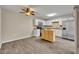 Bright kitchen features white cabinets, stainless steel appliances, and a center wooden island at 3824 Saxon Dr, New Smyrna Beach, FL 32169