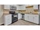 Close-up of the kitchen features stainless steel appliances and tiled backsplash at 3824 Saxon Dr, New Smyrna Beach, FL 32169