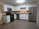 Kitchen with stainless steel appliances and white cabinets at 3824 Saxon Dr, New Smyrna Beach, FL 32169