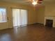 The living room features wood-look tile floors, a decorative fireplace and ample natural light at 3824 Saxon Dr, New Smyrna Beach, FL 32169