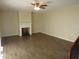 The living room features wood-look tile floors and a decorative fireplace at 3824 Saxon Dr, New Smyrna Beach, FL 32169