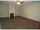The living room features wood-look tile floors and a decorative fireplace at 3824 Saxon Dr, New Smyrna Beach, FL 32169