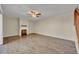 Spacious living room with hardwood floors and a cozy fireplace at 3824 Saxon Dr, New Smyrna Beach, FL 32169