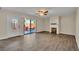 Sunlit living room with a decorative fireplace and a glass sliding door at 3824 Saxon Dr, New Smyrna Beach, FL 32169