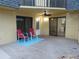 Covered patio with outdoor seating and sliding glass doors leading to interior space at 3824 Saxon Dr, New Smyrna Beach, FL 32169