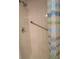 A shower stall featuring white tile and a colorful shower curtain at 3824 Saxon Dr, New Smyrna Beach, FL 32169