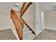 Carpeted staircase with wooden railing leading to the upper level at 3824 Saxon Dr, New Smyrna Beach, FL 32169