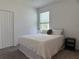Bright bedroom with a full bed, carpeted floors and a scenic window view at 3919 Willowbrook Dr, Edgewater, FL 32141
