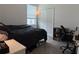 Bedroom with a full sized bed, workstation and roomy closet at 3919 Willowbrook Dr, Edgewater, FL 32141