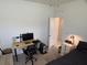 Clean bedroom featuring workstation area, a bed, and carpeted floor at 3919 Willowbrook Dr, Edgewater, FL 32141