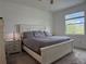 A serene bedroom boasts natural light, plush carpet, and a neutral color palette, creating a tranquil retreat at 3919 Willowbrook Dr, Edgewater, FL 32141