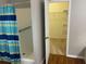 Bathroom features a walk-in shower and is connected to a carpeted walk-in closet at 405 Central Mariners Dr, Edgewater, FL 32141