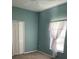 Bedroom featuring double door closet, neutral wall color and carpeted flooring at 405 Central Mariners Dr, Edgewater, FL 32141