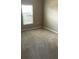Bedroom with wall to wall carpet, a window, and neutral colored walls at 405 Central Mariners Dr, Edgewater, FL 32141