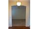 Archway view of living space featuring carpeted floors, neutral walls, and a modern ceiling fan at 405 Central Mariners Dr, Edgewater, FL 32141