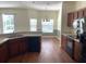 Well-equipped kitchen with stainless steel appliances, wood cabinets and breakfast bar overlooking the dining area at 405 Central Mariners Dr, Edgewater, FL 32141