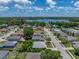 An aerial perspective shows a single-story home surrounded by lush greenery, offering a sense of peace and privacy at 411 Ryans Ridge Ave, Eustis, FL 32726