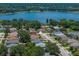 Residential neighborhood aerial view, showcasing a gray house near a lake at 411 Ryans Ridge Ave, Eustis, FL 32726