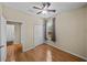 Cozy bedroom with ceiling fan, double door closet, and a window at 411 Ryans Ridge Ave, Eustis, FL 32726