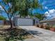 Charming single-story home featuring a two-car garage, landscaped yard, and a well-maintained driveway at 411 Ryans Ridge Ave, Eustis, FL 32726