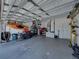 Spacious garage with ample storage, including bikes and a kayak at 411 Ryans Ridge Ave, Eustis, FL 32726