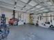 Spacious garage with ample storage, tools, and room for multiple vehicles and hobbies at 411 Ryans Ridge Ave, Eustis, FL 32726